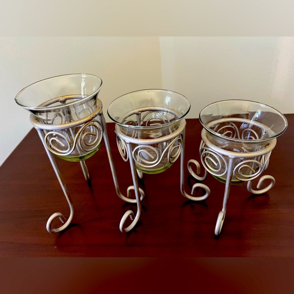 Trio standing candle cups.